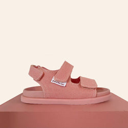 We are obsessed with the Pink OG Sandal by Piccolini, perfect for summer!  These Aussie-designed sandals are a collab by a footwear designer and a chiropractor, making them not only stylish but podiatrist-approved!   Features: Made out of premium certified organic cotton Podiatrist Recommended Soft moulded footbed Machine Washable Easy 3 velcro strap closure Genuine non-slip rubber sole Designed in Australia by Piccolini 